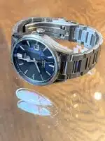 Men's Tag Heuer Carrera watch with a black dial and stainless steel.bracelet