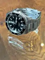 Men's Tag Heuer Aquaracer quartz watch with a black dial