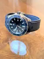 Tag Heuer Aquarecer men's watch with a blue dial and blue rubber strap.