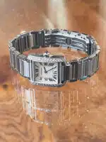 Cartier Tank Francaise 2384. Steel case and bracelet, white dial and diamond surround bezel.