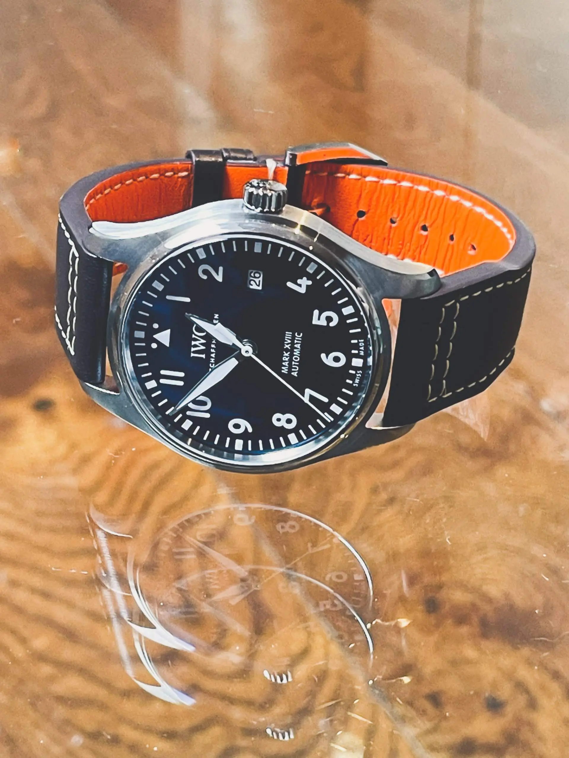 IWC Pilot Watch Mark XVIII IW327004 ‘Le Petit Prince’ 40mm IWC Pilot Watch Mark XVIII IW327004 'Le Petit Prince' 40mm men's watch with a blue dial and brown leather strap.