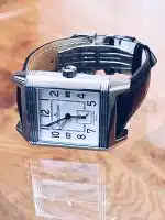 Jaeger LeCoultre Reverso Squadra Hometime men's reversible dial watch with a black leather strap.