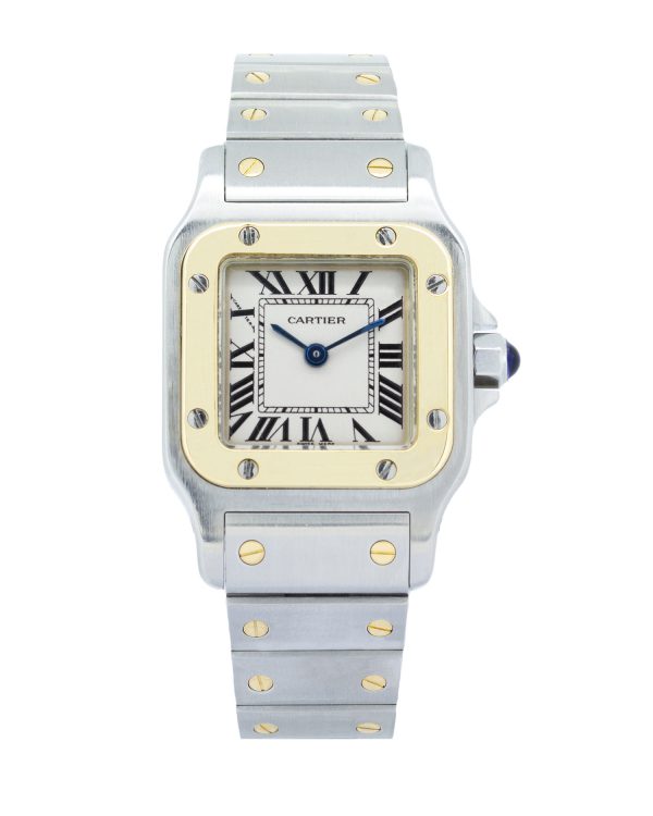 Cartier Santos Galbée Ref. 1567 luxury women's watch featuring a two-tone stainless steel and 18k yellow gold case and bracelet, silver dial with black Roman numerals, blued steel hands, and signature blue cabochon crown, displayed on a woman's wrist against a soft neutral background.